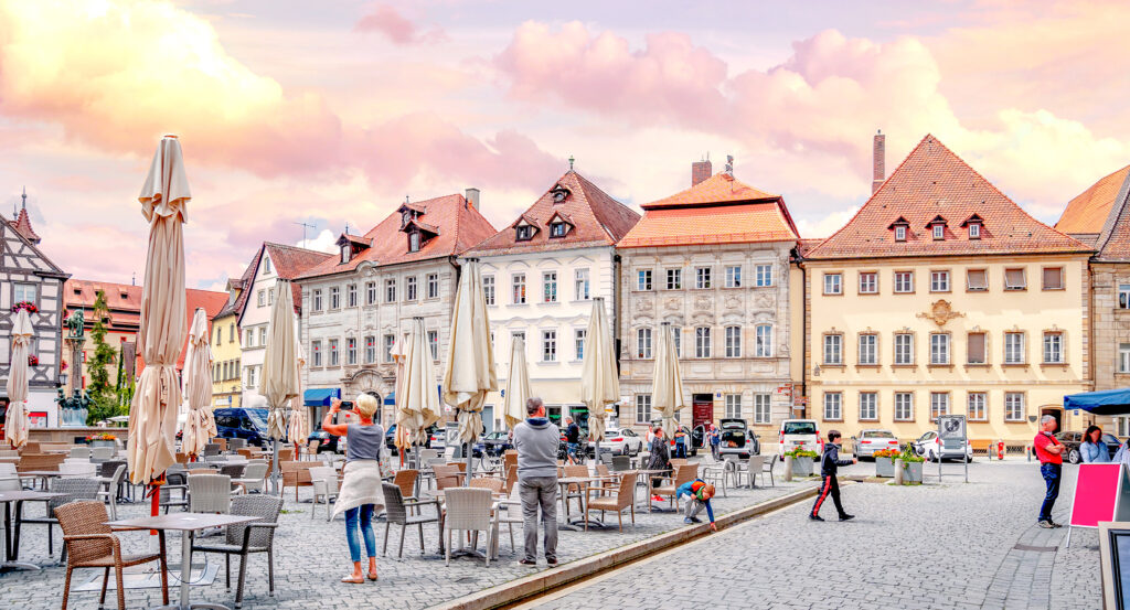 View of Zurich Paradeplatz with people and shops at sunset