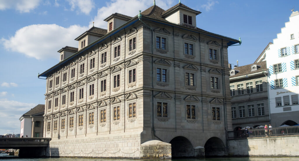Facade of Zurich Rathaus with clock tower and sculptures