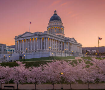 Utah State Capitol at sunset surrounded by cherry blossoms in Salt Lake City, Utah